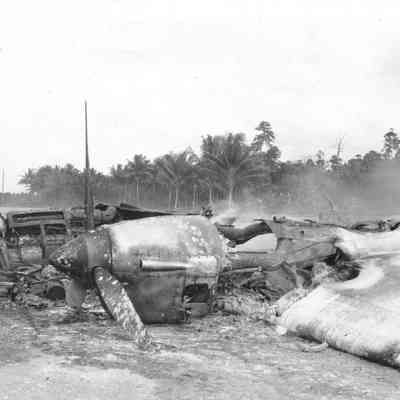 Photo of crashed airplane during WWII. Tear from upper right hand corner.
