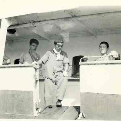 Photo of men leaving ship during WWII.