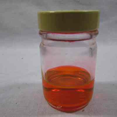 Bottle with orange liquid in firstaid kit.