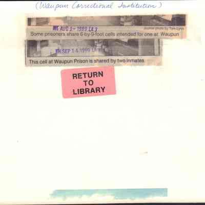 Info on back of photo of shared prison cell.