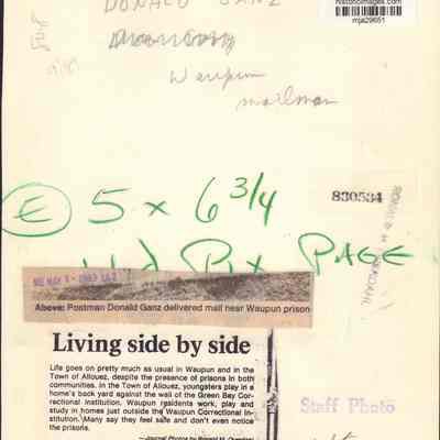 Info on back of photo of Waupun mailman by prison