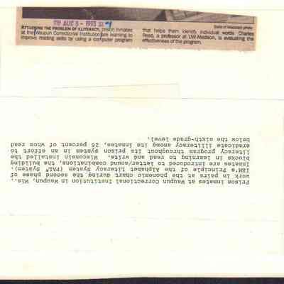 Info on back of photo of inmates using computer.
