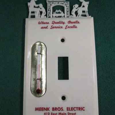 Wall plate, switch advertising Meenk Bros. Electric