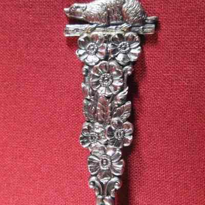 Floral with badger on handle of spoon