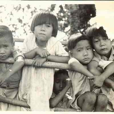 Grouping of native children. Damage to the upper right hand corner of picture.
