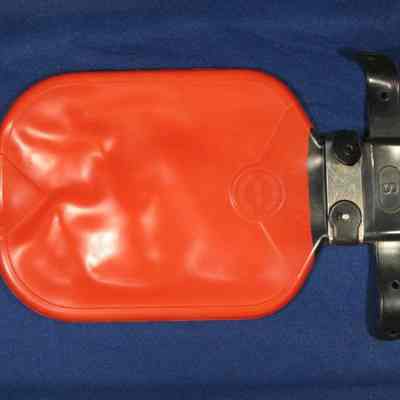 Hotwater bottle with connector for syringe.