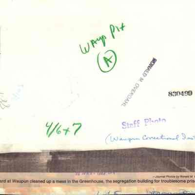 Info on back of photo of riot cleanup