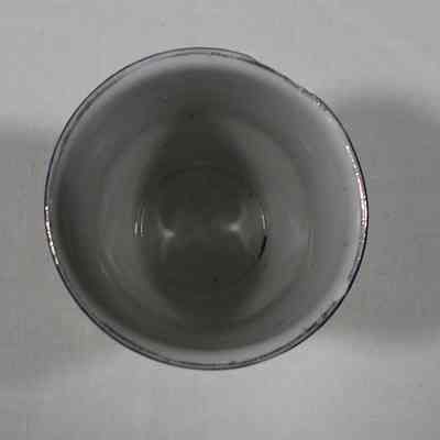 Cup with "Wisconsin State Prison at Waupun" on it.