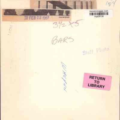 Info on back of photo of Bars of prison.