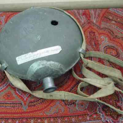 Water tin punctured by bullet.