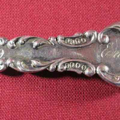 Back side of spoon with date and name "Emma"