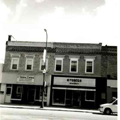 1993 photo of commercial buildings at 301-307 E. Main