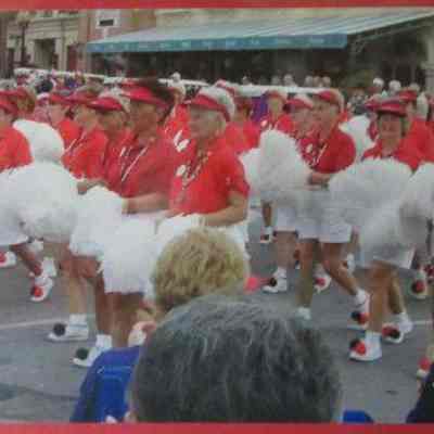 Red Hat cheerleaders marching in Spanish Spring parade