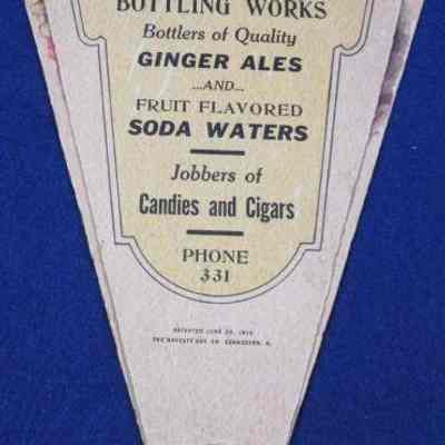  Hand held fan advertising Waupun Bottling Works.