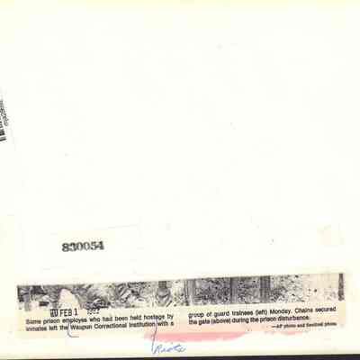 Back of photo of chained prison gate at Waupun