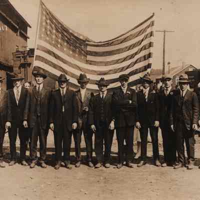 Postcard, Leaving for War, Flag between Farmers Elevator and RR Tracks