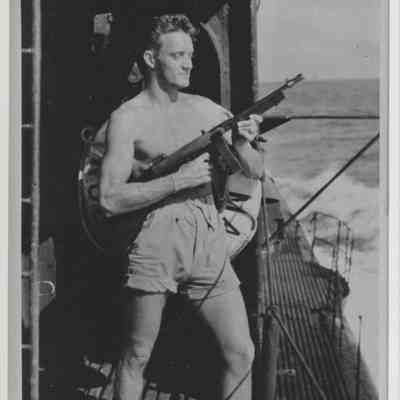 LT. Robert Worthington with "tommy gun"