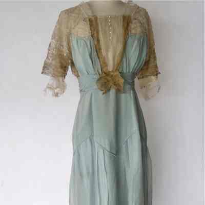 Long sleeve full length silk dress with beading on shoulders and sleeves