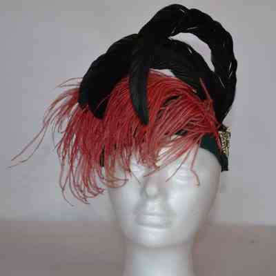 Felt casque with dark peach and black iridescent feathers and rhinestone butterfly pin