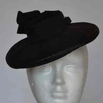 Small straw tilt hat with grosgrain bow