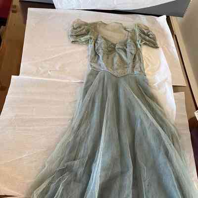 Blue sweetheart neckline floor length netting dress with embellished bodice