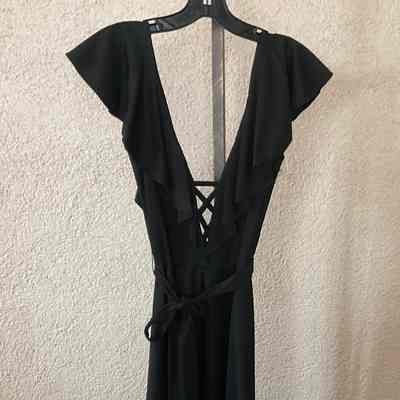 Ruffle neck sleeveless calf length jersey dress with self tie and deep V laced neckline