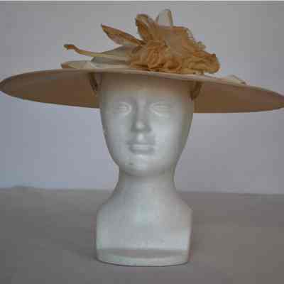 Straw wide brim hat with flower embellishment and velvet ribbon