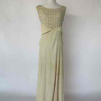 Long sleeveless scoop neck bias dress with embellished bodice with attached self sash