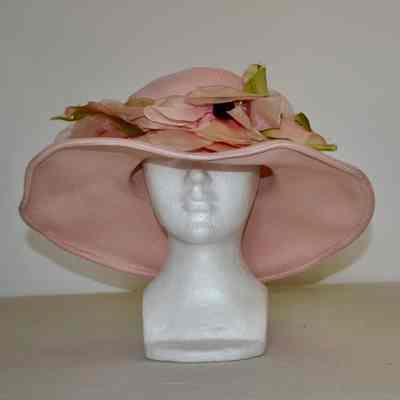 Straw wide brimmed hat with floral detail circling crown