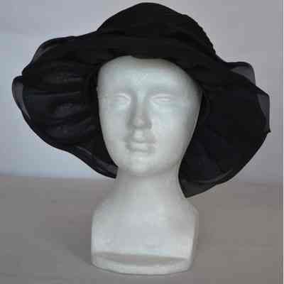 Pleated fabric crown with ruffled brim