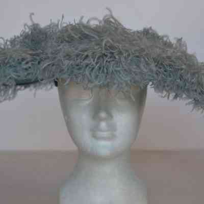 Wide brimmed velour picture hat with large plumes covering brim