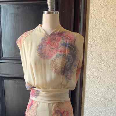 Full length v-neck sleeveless floral dress with self appliqués