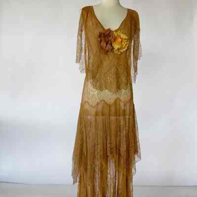 Lace/chiffon long v-neck dress with tiered skirt and floral embellishment at front