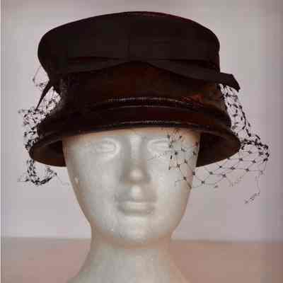 Straw bucket hat wih grosgrain bow and net veil