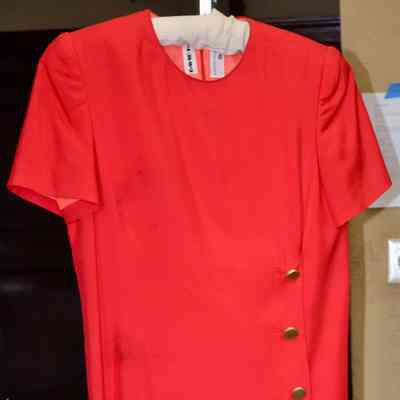 Low waisted short sleeve pleated dress with gold button accents