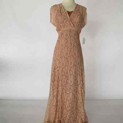 Spaghetti strap slip floor length dress with light pink lace over dress with surplice bodice and back peplum