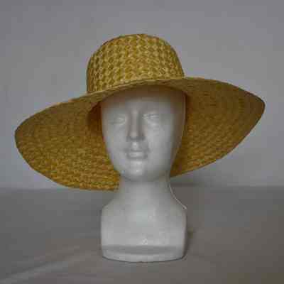 Straw basket weave floppy wide brim hat , with indented creased crown