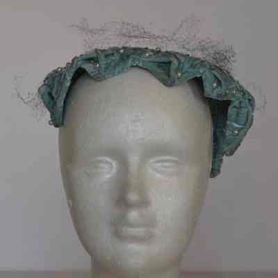 Embossed velvet casque with embellishment and netting