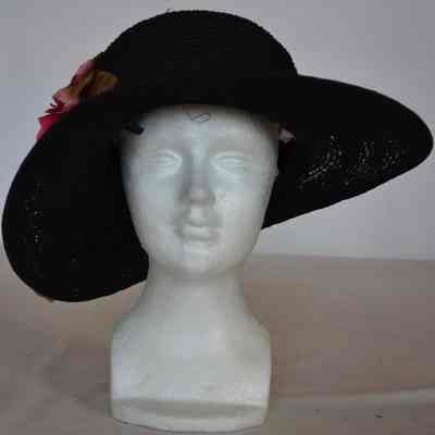 Straw wide brim hat with tall crown and pink rose trimming on right side