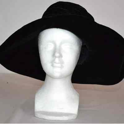 Wide turn up brim velvet hat with gold and silver flower trimming on back