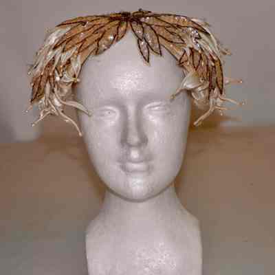 Cocktail hat of satin petals, sequins and beads
