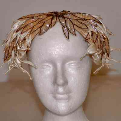 Cocktail hat of satin petals, sequins and beads