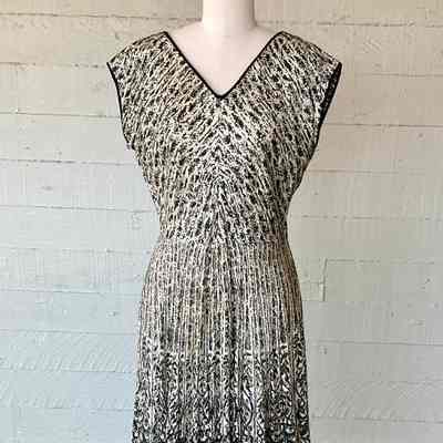 Printed V neck dress with grown on sleeve and set in bodice