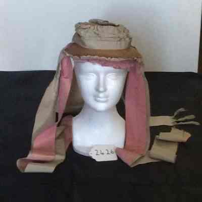 Straw bonnet with green and pink gros grain ribbons