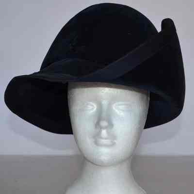 Velvet brimmed hat with grosgrain trim, high crown and brim flipped up on side