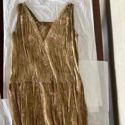 Gold beaded low waisted party dress with fringed skirt