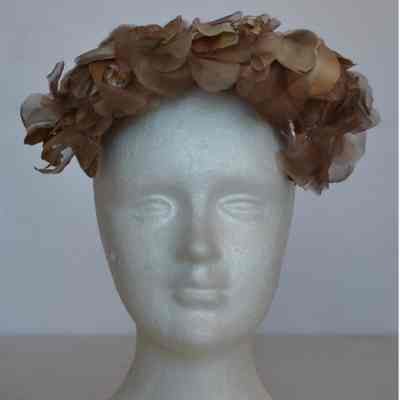 Faux flower covered casque
