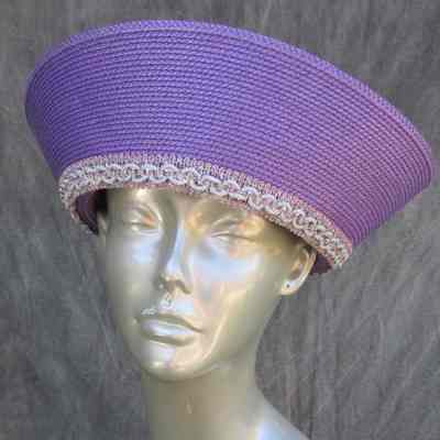 Purple hat with white trim at base of crown