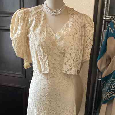 Machine lace wedding dress over slip with matching puff sleeve short jacket