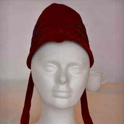 Red velvet child’s bonnet with black beaded trim and self tie